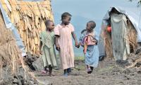 Girls displaced by war in the eastern Congo live in a displaced persons camp set up on a lava flow in the village of Nzulu.  Photo: Paul Jeffrey/Life on Earth