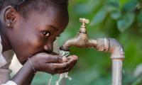 A little girl drinking clean water from a tap. 123rf.com