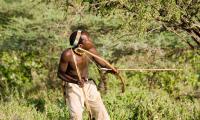 Tanzania. A Hazabe bushman with bow and arrow during hunting. 123rf.com