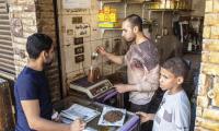 Egypt. Coffee beans are weighed and sold in a shop in Cairo.  © FAO/Pedro Costa Gomes