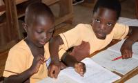 Two little girls at school. Compulsory education starts in kindergarten, continues through elementary school, and ends in lower secondary school.