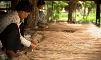 Women weaving mats. FAO