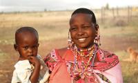 Maasai mother with a child. “The children are the bright moon”. (Maasai Proverb) Photo: Joseph Caramazza